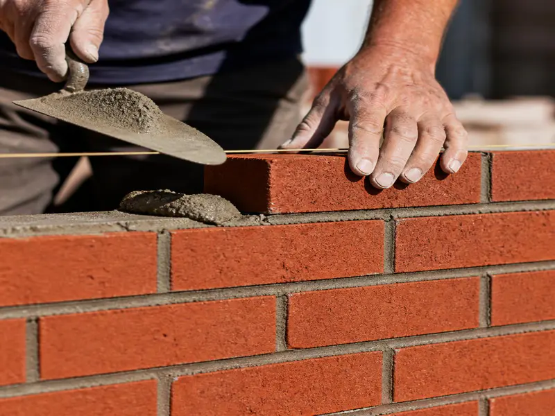 Red clay bricks and cement mortar for house partition wall masonry